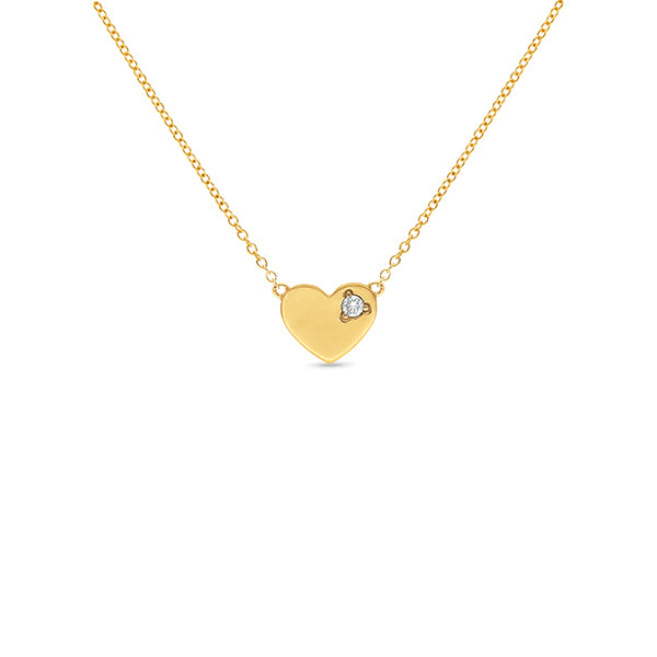 Heart pendant set with a single diamond.
